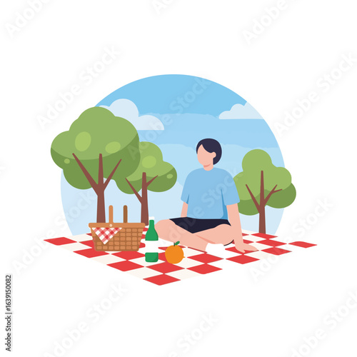 Enjoying picnic time with wicker basket, blanket, and a man relaxing in a park. Picnic time is a great way to enjoy nature, fresh air,