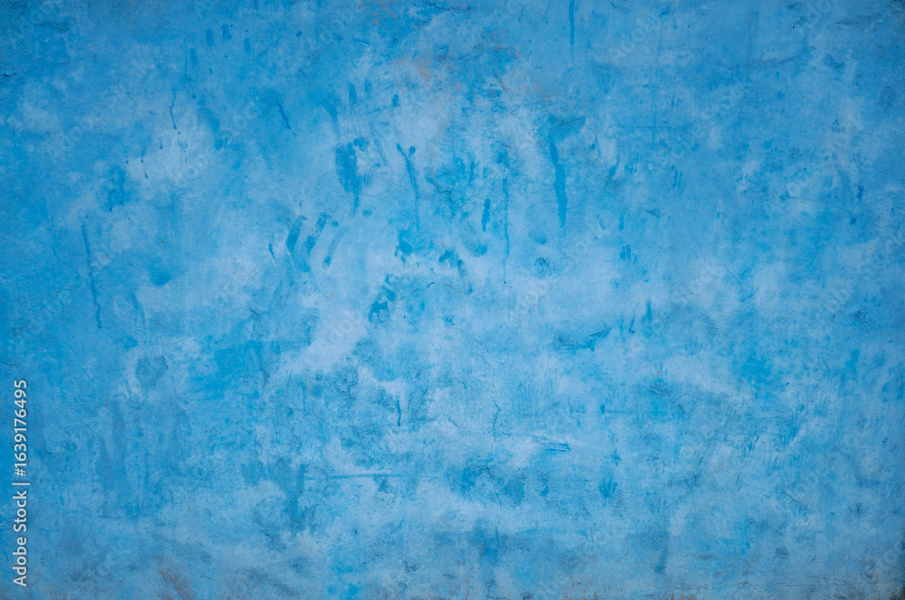 Fototapeta premium Vibrant Blue Textured Wall Background with Subtle Color Variations and Gradients.