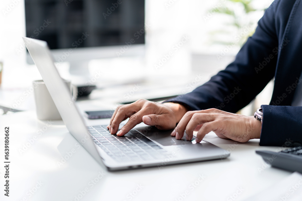 Asian Adult Businessman Hands Typing on Laptop Keyboard in Modern Office Workspace for Financial Analysis and Business Data Entry Work Asian Adult Businessman Hands Typing on Laptop Keyboard in Modern Office Workspace for Financial Analysis and Business Data Entry Work