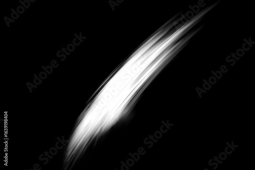 Abstract white light streak moving across a stark black background with a sense of speed and motion