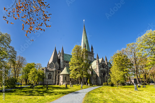 Fotografie Grand Gothic Cathedral Architecture with Sunlight on a Clear Blue Sky, Nidaros,
