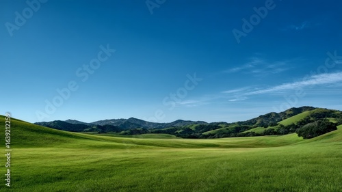 Rolling hills with blue sky and mountains. AI generated