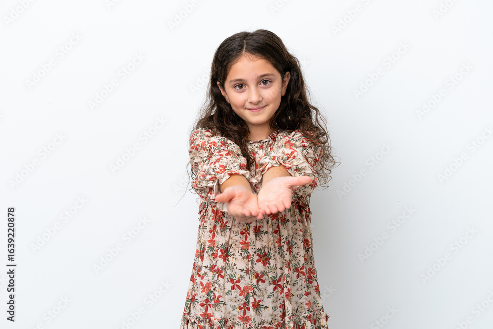 Little caucasian girl isolated on white background holding copyspace imaginary on the palm to insert an ad Little caucasian girl isolated on white background holding copyspace imaginary on the palm to insert an ad