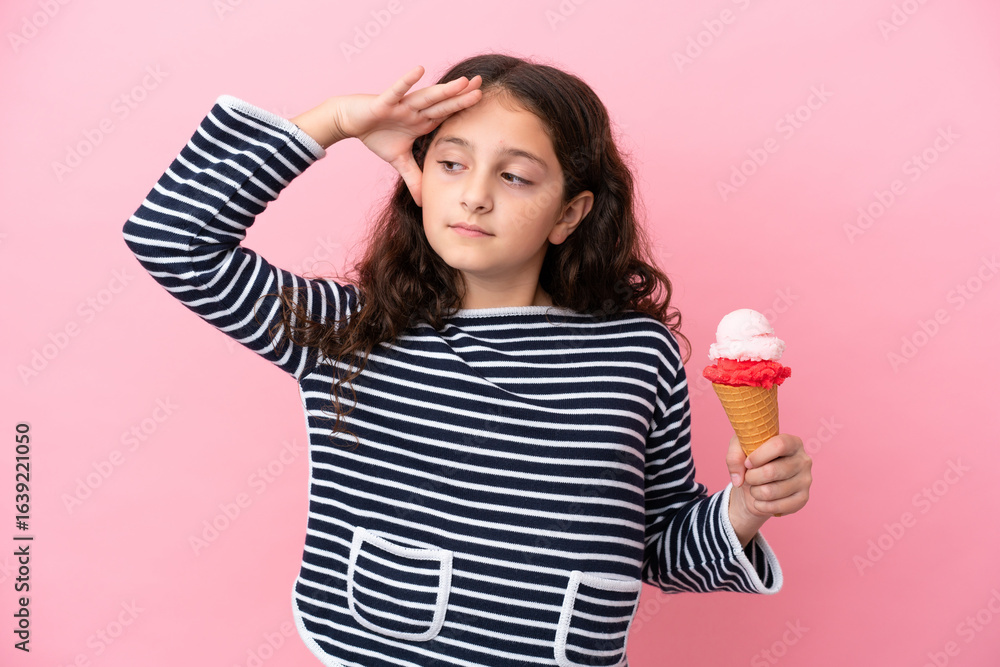 Little caucasian girl holding an ice cream isolated on pink background smiling a lot Little caucasian girl holding an ice cream isolated on pink background smiling a lot