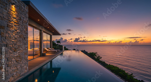  A luxurious villa perched on a cliff with an infinity pool blending seamlessly into the ocean horizon  featuring floor-to-ceiling glass walls and natural stone walls. Captured in sunset light.   