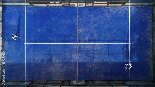 Aerial view of practice people at the blue paddle tennis courts