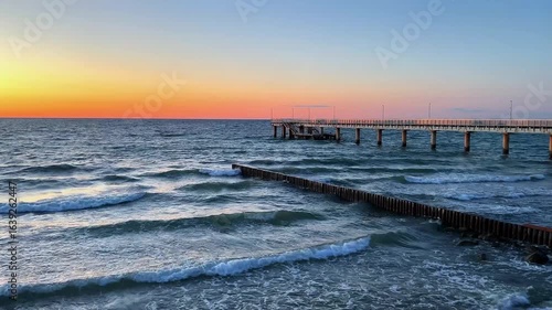Wallpaper Mural Sunset gradient from blue to orange above blue ocean water. Meditation content, moody aesthetics Torontodigital.ca