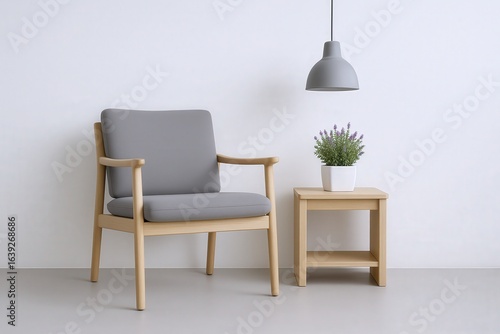 Modern Scandinavian Armchair and Side Table with Potted Plant and Pendant Lamp in Minimalist Interior Setting