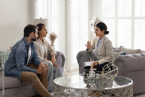Photos Relation counsellor helps to spouses, couple listening advice, gain professional