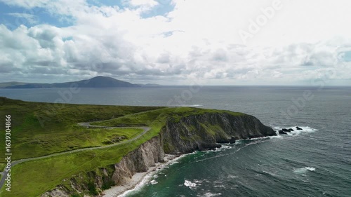 Beautiful view overlooking the cliff, ocean, descending road, Ashleam Bay Beach, Ireland