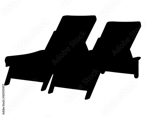 Silhouette of two empty lounge chairs evoking relaxation and summer vacation