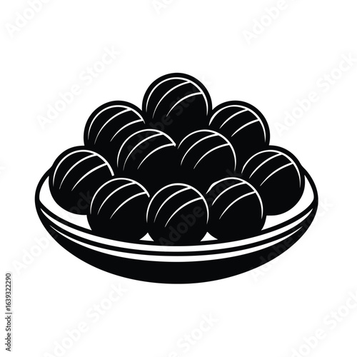 chocolate truffles on round plate silhouette minimal style