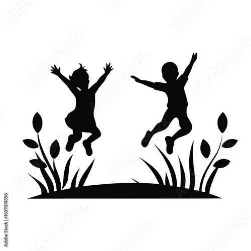 Two children joyfully jumping silhouette