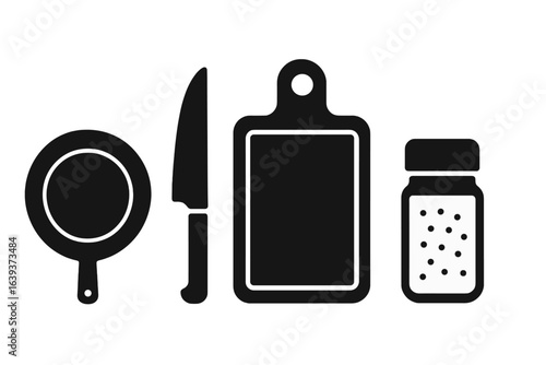 Kitchen tools arranged for cooking preparation with a strainer, knife, cutting board, and seasoning container clearly visible