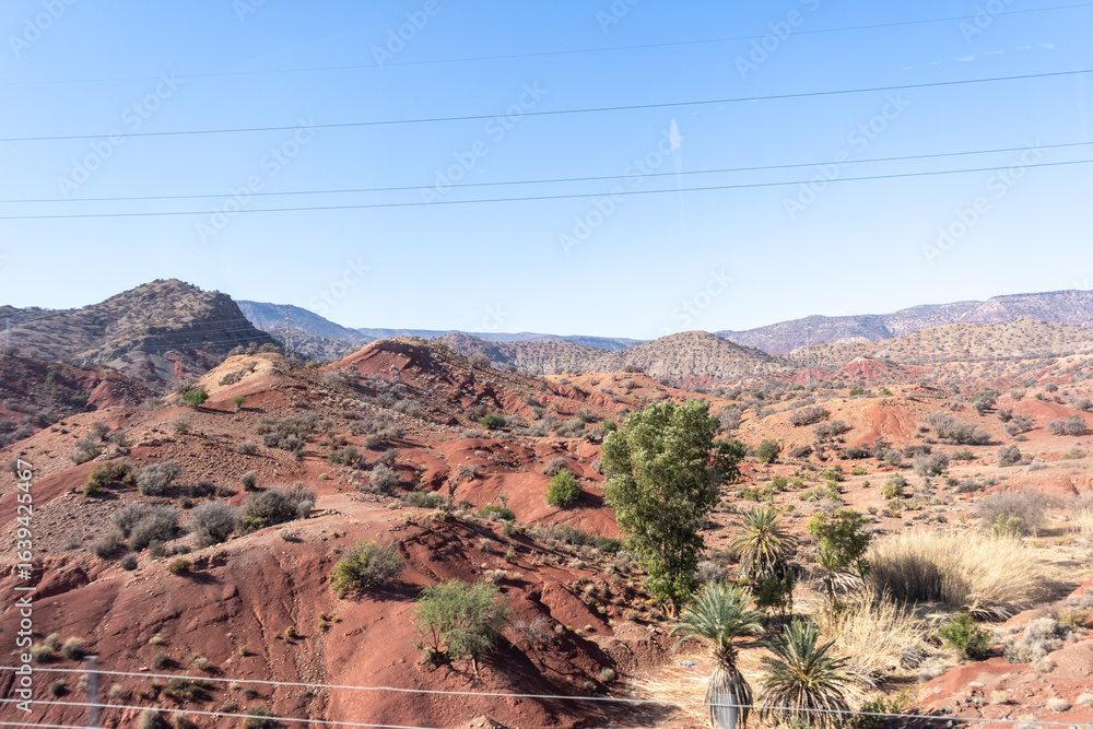 Obraz premium Morocco semi-deserts and mountains, north africa nature, Moroccan stone desert, red hills, villages and argan trees