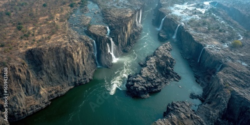 Fototapeta Naklejka Na Ścianę i Meble -  River systems cut off midair, waterfalls suspended above blackness