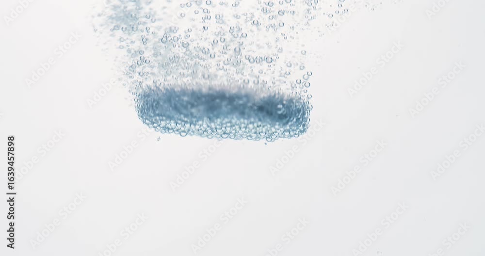 Extreme Close-up effervescent tablet, pill bubbling underwater. Shot on super slow motion camera 1000 fps. Extreme Close-up effervescent tablet, pill bubbling underwater. Shot on super slow motion camera 1000 fps.