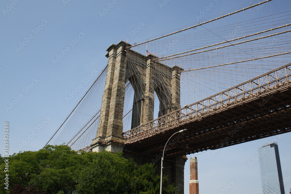 Obraz premium Brooklyn Bridge from below - New York City - USA - 2019 - Adobe Stock