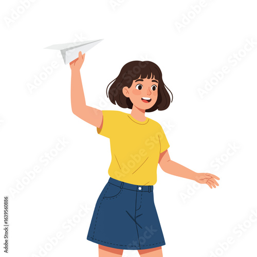 Happy girl joyfully throws a paper airplane, embodying carefree childhood fun.