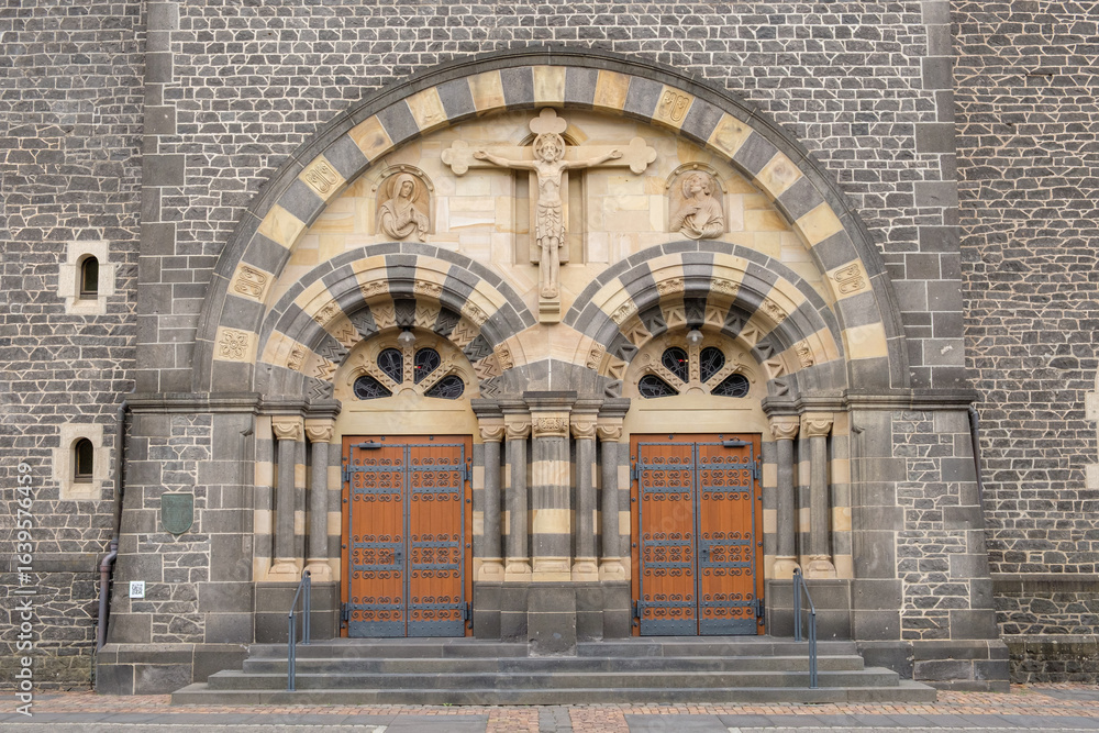 Obraz premium Church portal of Herz-Jesu-Kirche Mayen – Neo-Romanesque Catholic Church with Twin Towers in Rhineland-Palatinate, Germany