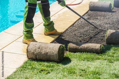 Obraz na plátně Landscaping Project Involving Turf Installation Near a Swimming Pool