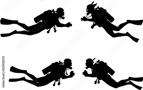 Silhouette of two scuba divers with cameras swimming underwater near coral and fish in the ocean water

