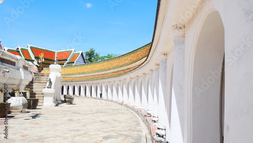 Photography Beautiful arched walkway and traditional temple roof at a Buddhist temple in Tha