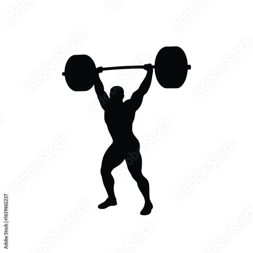 Silhouette of a strong weightlifter lifting a heavy barbell overhead