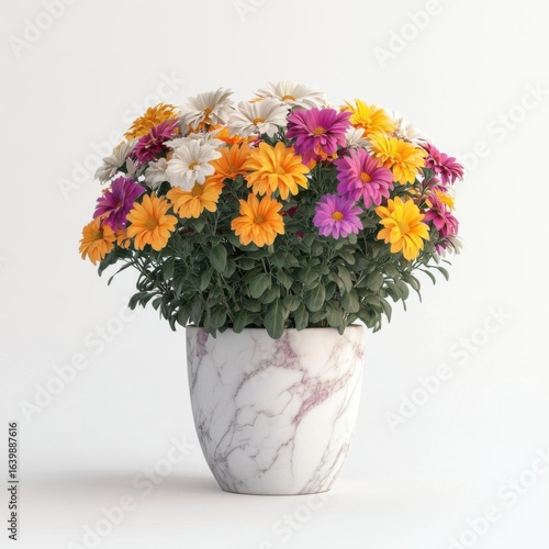 Vibrant flowers in a decorative marble pot.