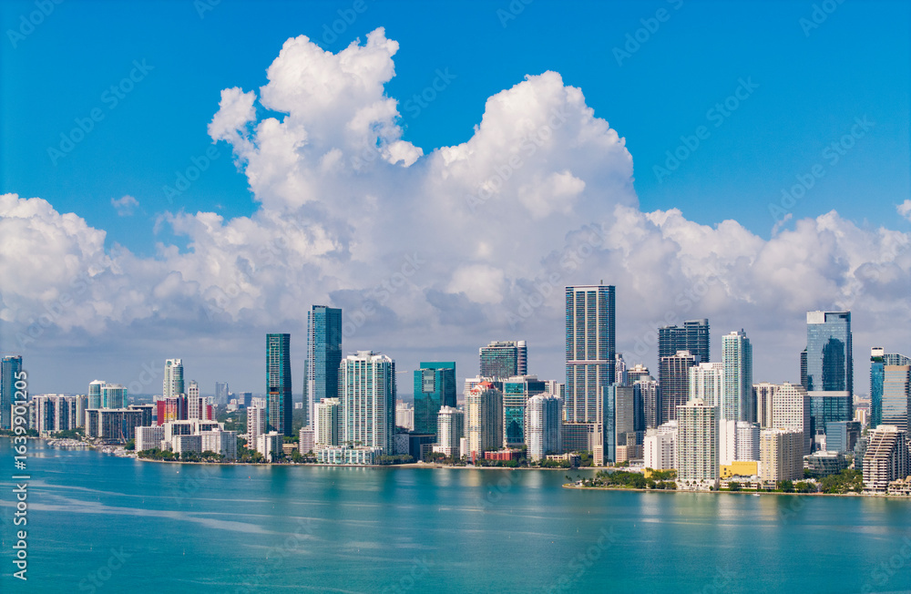 Naklejka premium Famous landmarks of Miami Brickell from above. Drone view of the Brickell in Miami city. Business in Brickell district. Biscayne Bay Florida iconic urban coastline in daylight.