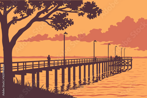 sunset view over Mobile Bay in fairhope alabama with the pier stretching into glowing orange water