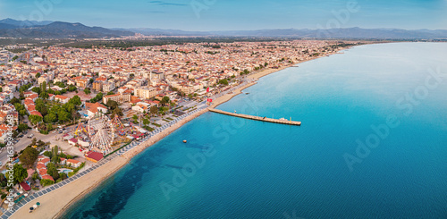 Fototapeta Naklejka Na Ścianę i Meble -  Panoramic view of Akcay, Turkiye coastline, featuring hotels, beaches, and the inviting turquoise waters of the Aegean Sea, a perfect summer getaway