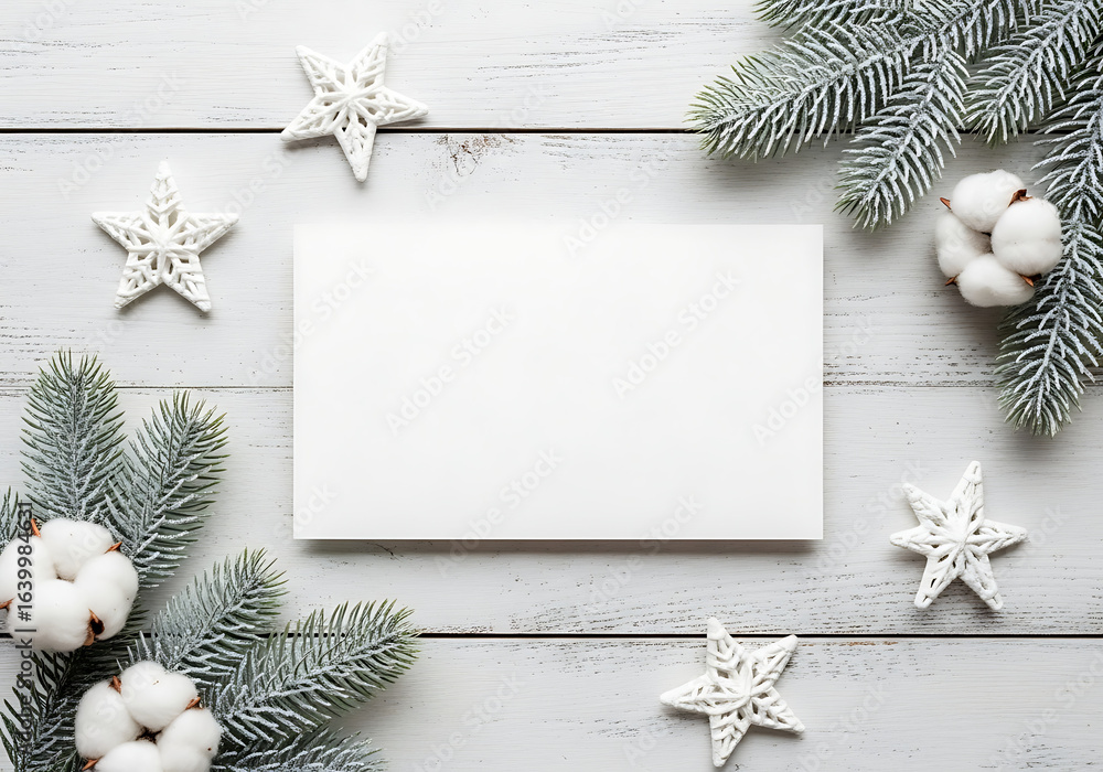 Fototapeta premium Christmas and Winter Holiday Flatlay with Festive Decorations Including Pine Branches, Stars and Cotton on White Wooden Surface with Copy Space