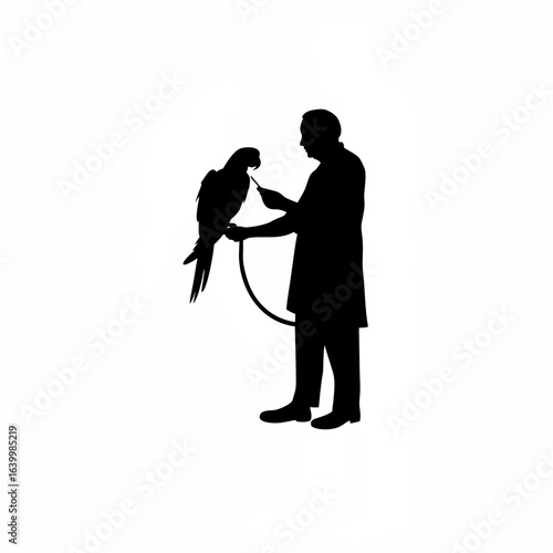 Senior male veterinarian examining an exotic animal with care