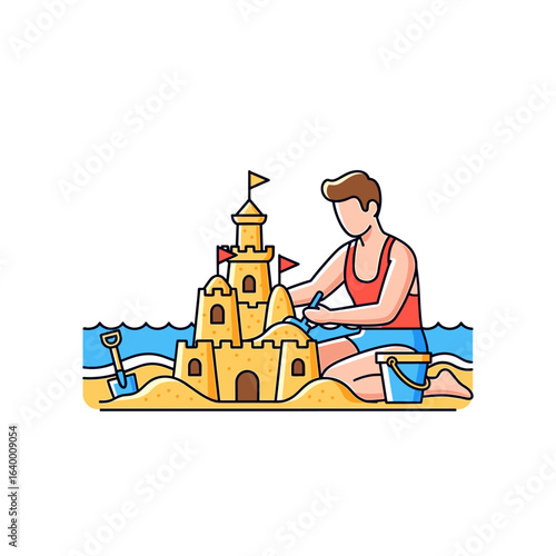 Young boy building an impressive sandcastle on the beach with colorful flags adorning it