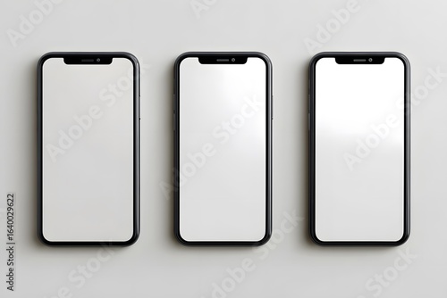 Three smartphones mockup with blank white screens for app design presentation