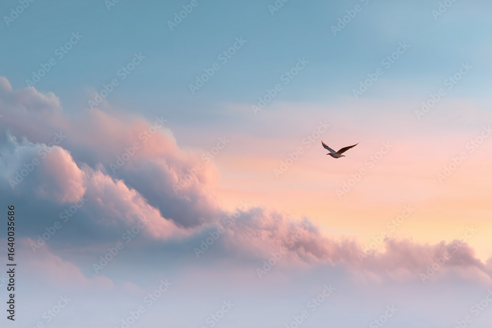 Fototapeta premium A bird flying freely in the sky. The scene captures the essence of freedom, serenity, and the boundless sky