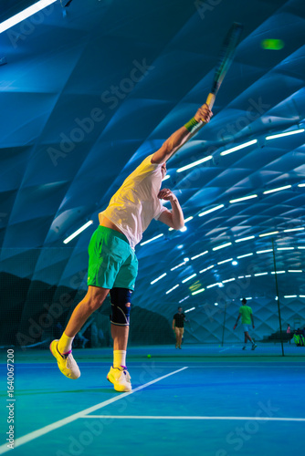 Man playing tennis on a court