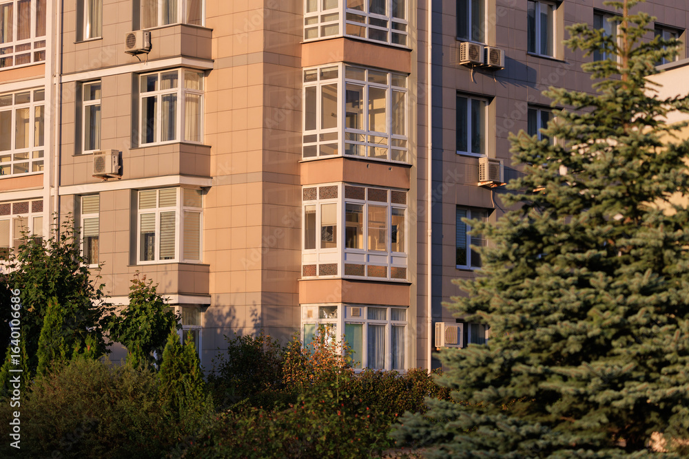 Fototapeta premium City view, modern buildings against the blue sky.