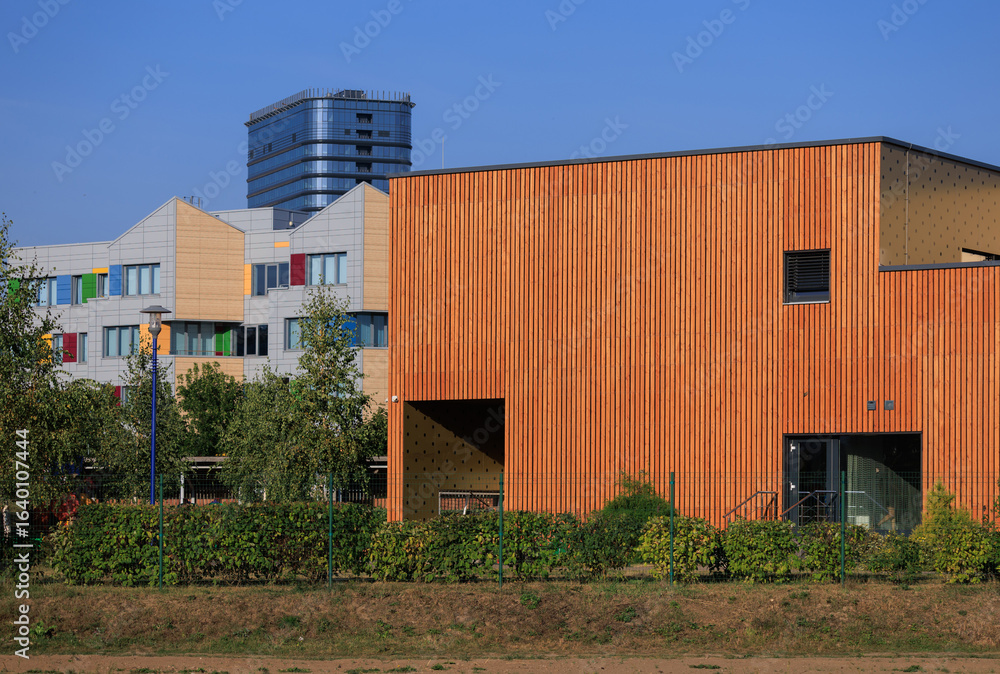 Fototapeta premium Cityscape on a summer day, modern buildings and houses 