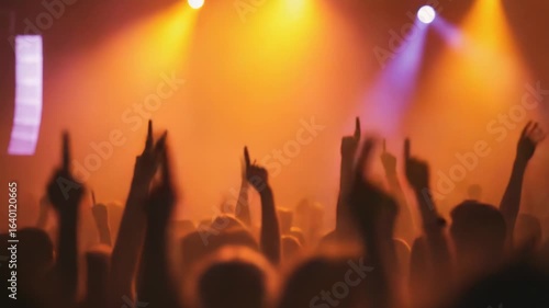 Wallpaper Mural A crowd of people raise their hands in unison during a concert, a moment of collective enthusiasm and energy Torontodigital.ca
