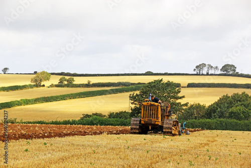Wallpaper Mural Vintage tractor ploughing a field	 Torontodigital.ca