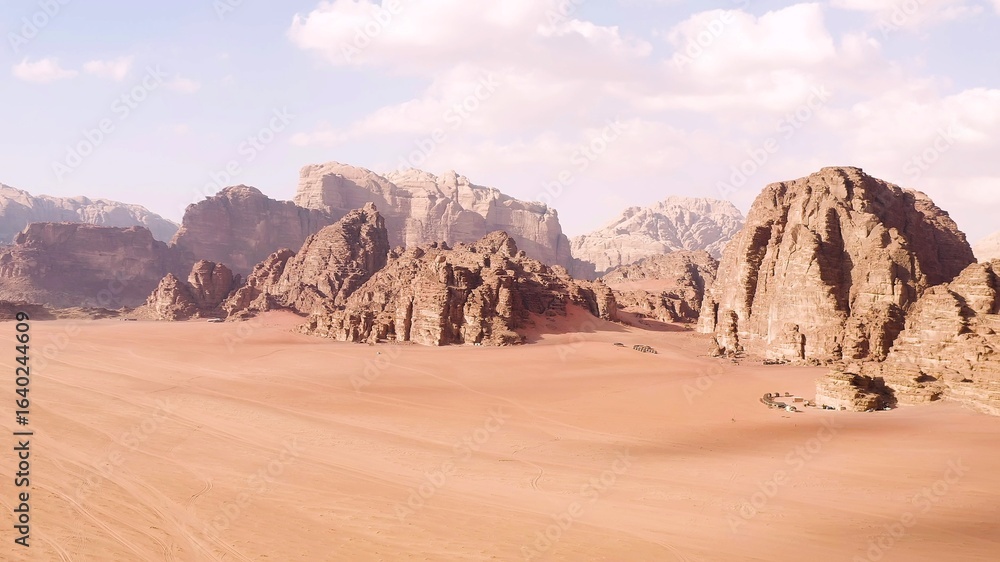 Fototapeta premium Spectacular aerial view over the sand and mountains of the desert of Wadi Rum, Jordan.