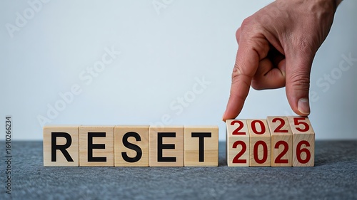 Wooden blocks showing reset concept with years 2025 and 2026