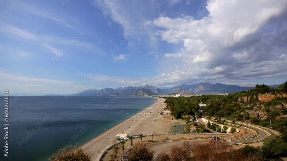 View of the beach and the road in the tourist part of the city Antalya.