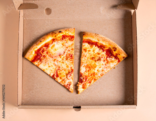 Pizza in a cardboard delivery box with two slices missing. Generative AI
