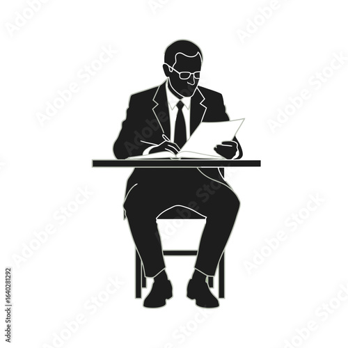 Silhouette of a professional man in a suit and glasses sitting at a desk, writing on a document.