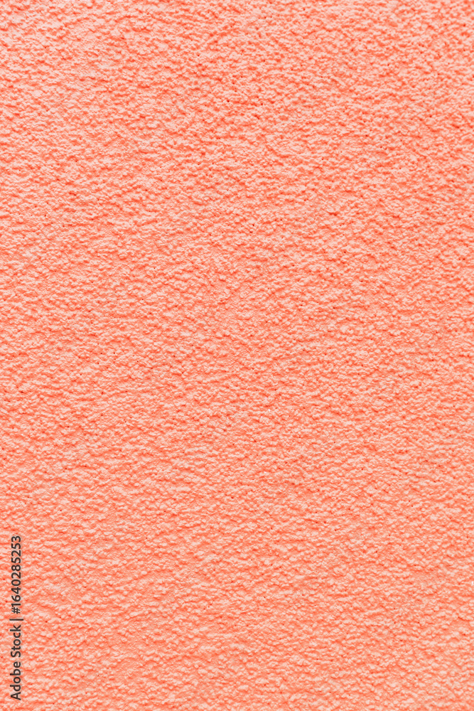 Fototapeta premium Textured abstract texture of a cement wall in soft pink color.