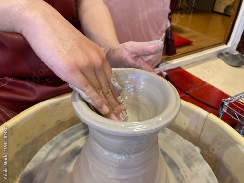 hands of a potter at work