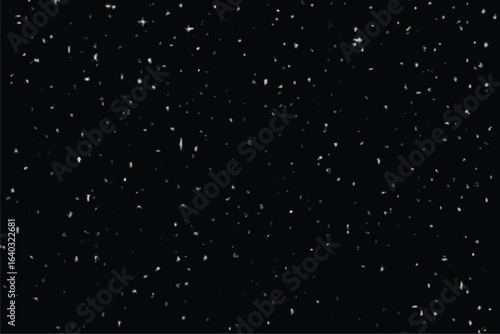 Falling snowflakes on a dark night winter holiday scene abstract effect